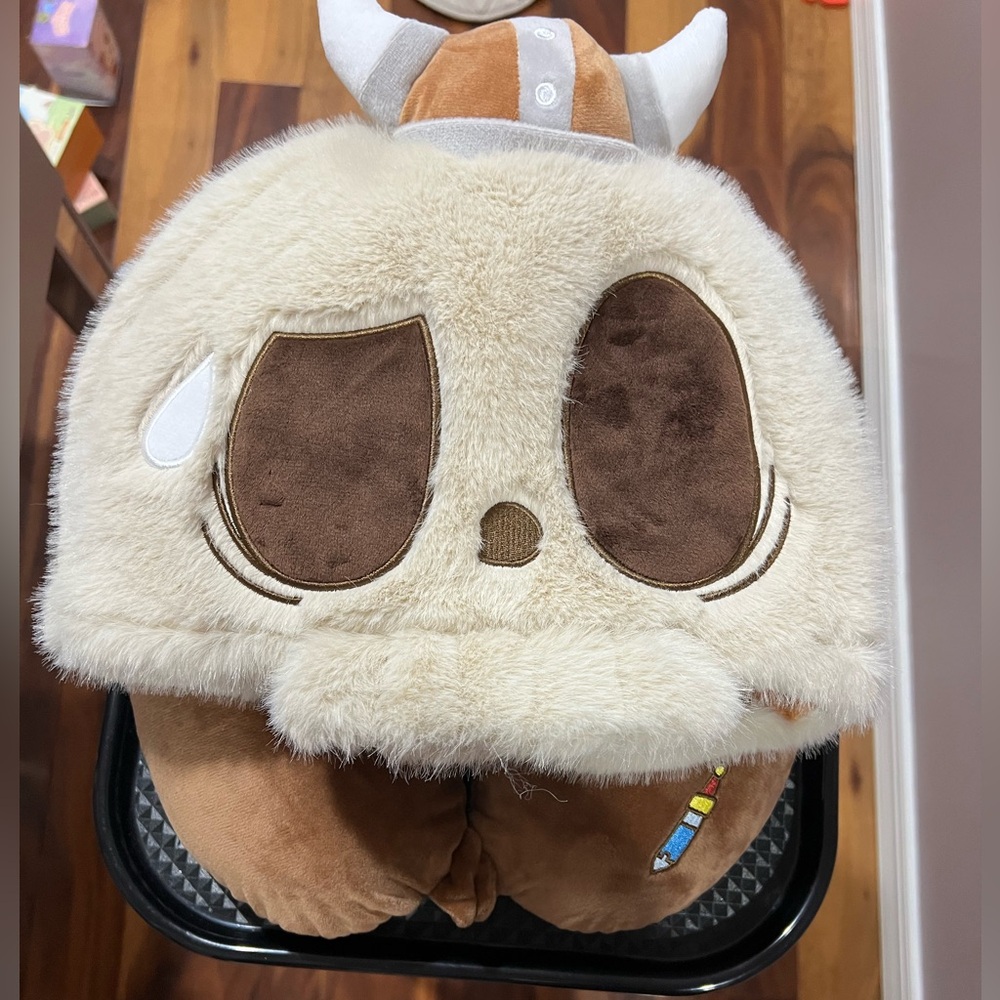 Popland shoulder pillow with Viking hood .